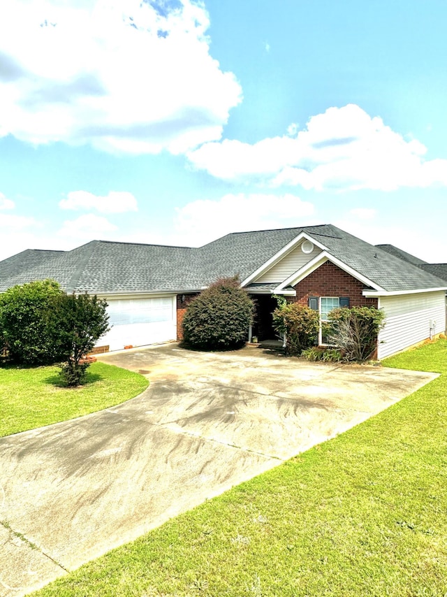 776 Michelle Ct, Grovetown, GA 30813 - view of front facade with concrete driveway, brick siding, a front lawn, and a shingled roof