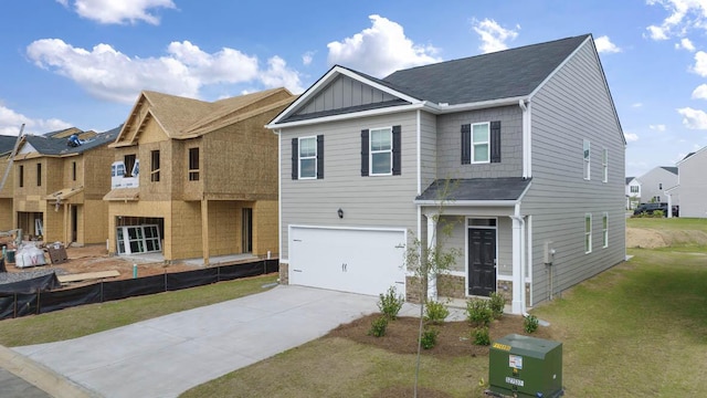 view of front of house with a garage and a front lawn