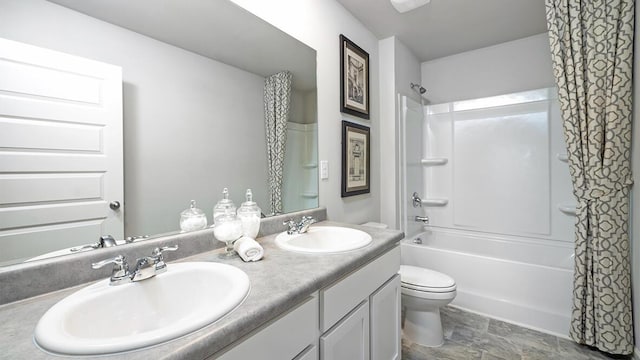 full bathroom featuring toilet, shower / tub combo with curtain, and vanity