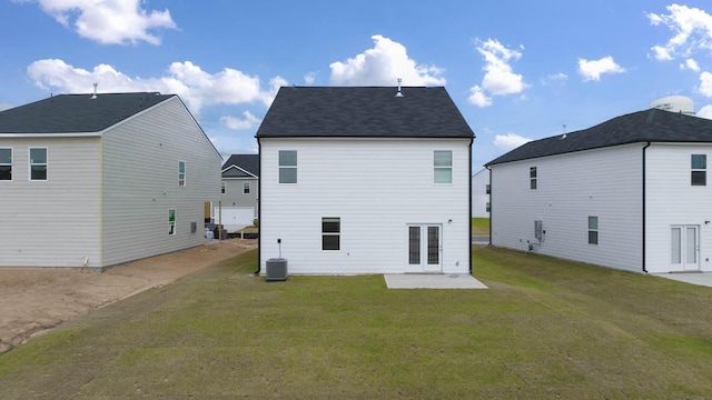 back of property featuring a patio, central AC unit, and a yard