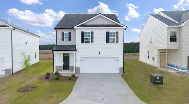 view of front facade with central AC unit, a garage, and a front lawn