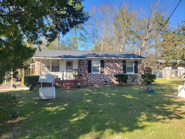 ranch-style house with a porch and a front lawn