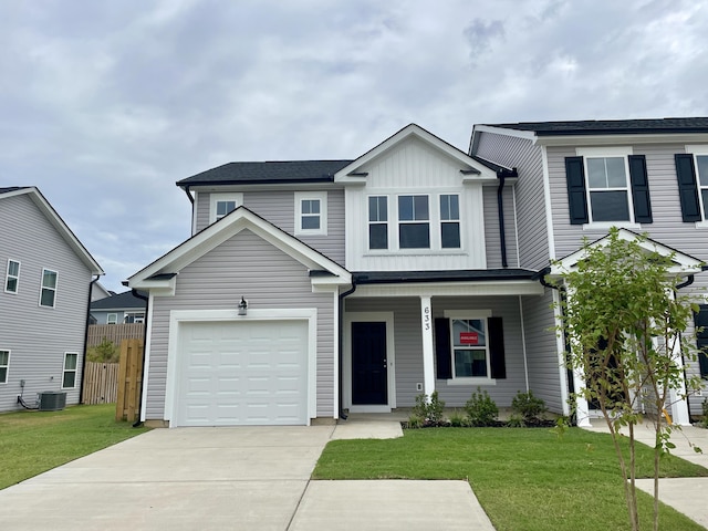 view of front of home with central air condition unit and a front lawn