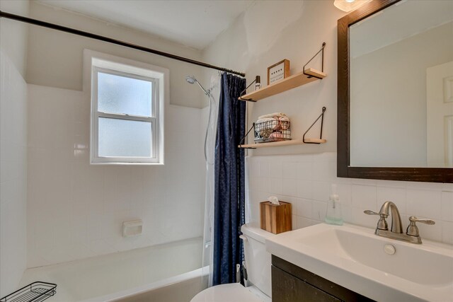 710 River View Dr, North Augusta, SC 29841 - full bathroom featuring vanity, toilet, tile walls, and shower / tub combo with curtain
