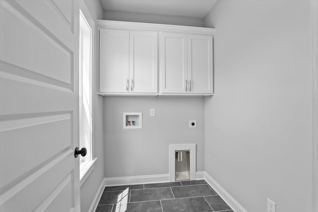 831 Whitney Shoals Rd, Evans, GA 30809 - washroom with hookup for an electric dryer, cabinet space, hookup for a washing machine, and dark tile patterned flooring