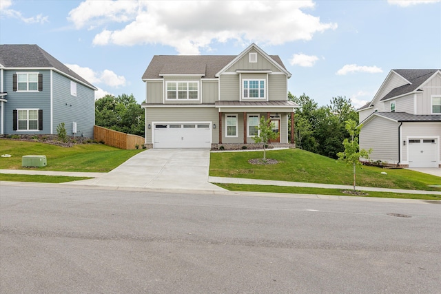 831 Whitney Shoals Rd, Evans, GA 30809 - view of front of house with board and batten siding, concrete driveway, and an attached garage
