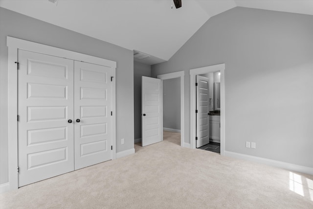 831 Whitney Shoals Rd, Evans, GA 30809 - unfurnished bedroom with lofted ceiling, carpet, a closet, ensuite bath, and a ceiling fan