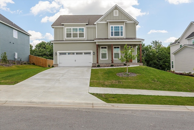 831 Whitney Shoals Rd, Evans, GA 30809 - craftsman-style house with board and batten siding, concrete driveway, a garage, a standing seam roof, and a metal roof