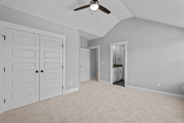 831 Whitney Shoals Rd, Evans, GA 30809 - unfurnished bedroom featuring carpet floors, a closet, lofted ceiling, ensuite bathroom, and a ceiling fan