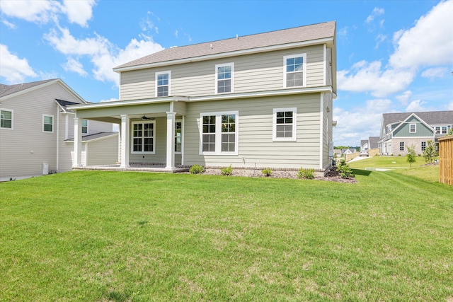 831 Whitney Shoals Rd, Evans, GA 30809 - back of property featuring ceiling fan, a patio area, and a lawn