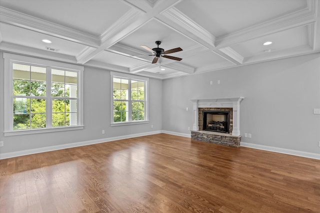 831 Whitney Shoals Rd, Evans, GA 30809 - unfurnished living room featuring a stone fireplace, wood finished floors, beamed ceiling, coffered ceiling, and ornamental molding