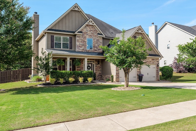 craftsman-style house with board and batten siding, stone siding, driveway, and a chimney