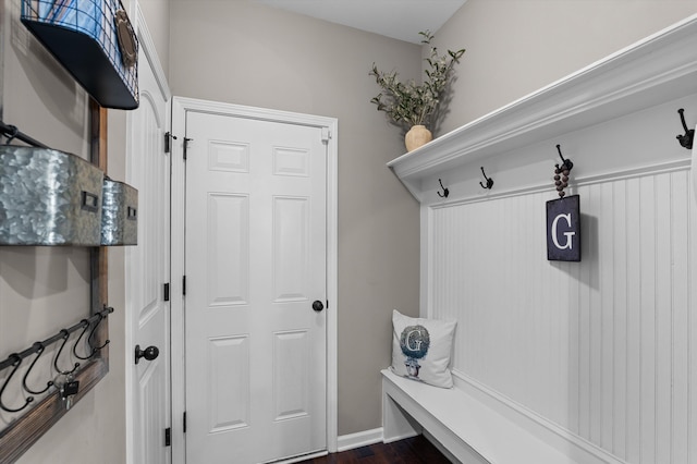 mudroom featuring dark wood finished floors