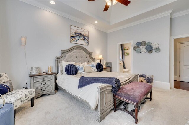 carpeted bedroom featuring connected bathroom, ceiling fan, and ornamental molding