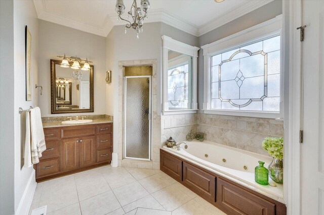 bathroom featuring plus walk in shower, vanity, crown molding, and tile patterned flooring