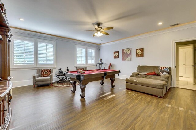 game room with dark hardwood / wood-style flooring, ceiling fan, crown molding, and pool table