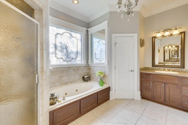 bathroom with plus walk in shower, tile patterned flooring, a notable chandelier, vanity, and ornamental molding