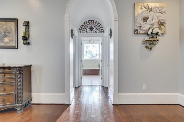 hallway with wood-type flooring