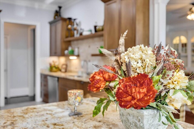 interior details with ceiling fan and dishwasher