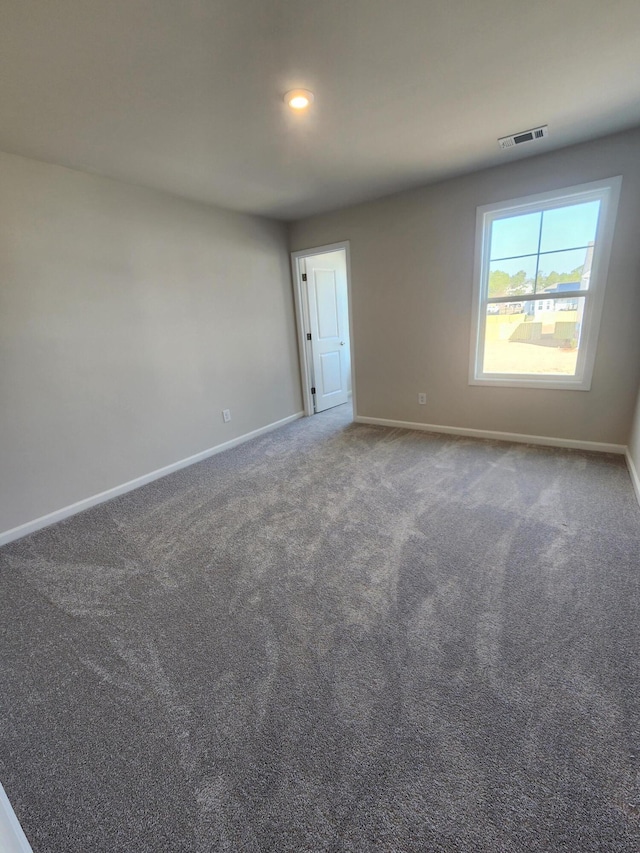 unfurnished room featuring carpet floors