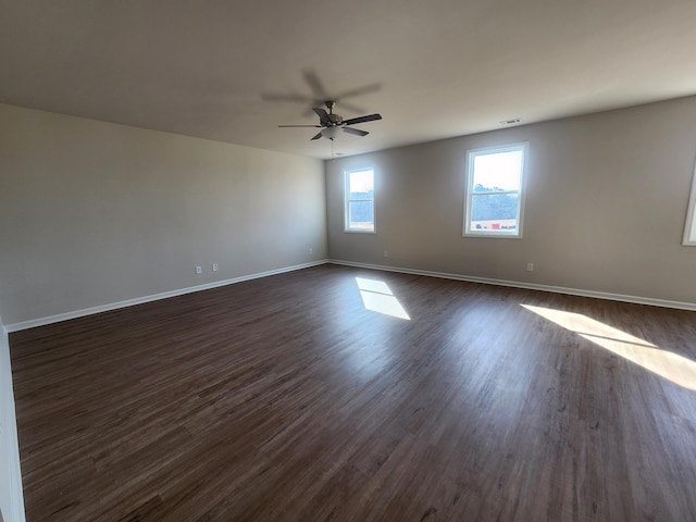 unfurnished room featuring dark hardwood / wood-style floors and ceiling fan