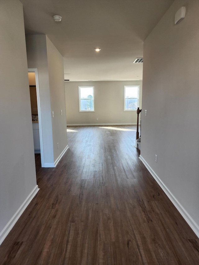 empty room featuring dark hardwood / wood-style flooring