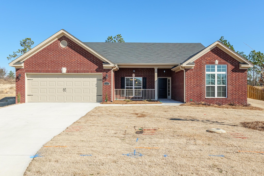 ranch-style house with a front lawn and a carport