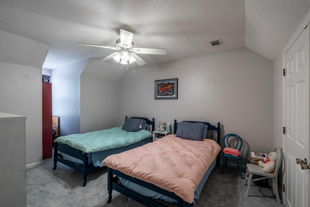 bedroom with ceiling fan, a textured ceiling, and lofted ceiling