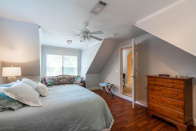 bedroom featuring ceiling fan, dark hardwood / wood-style flooring, and crown molding