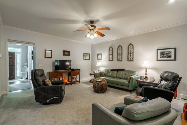 carpeted living room featuring ceiling fan and crown molding