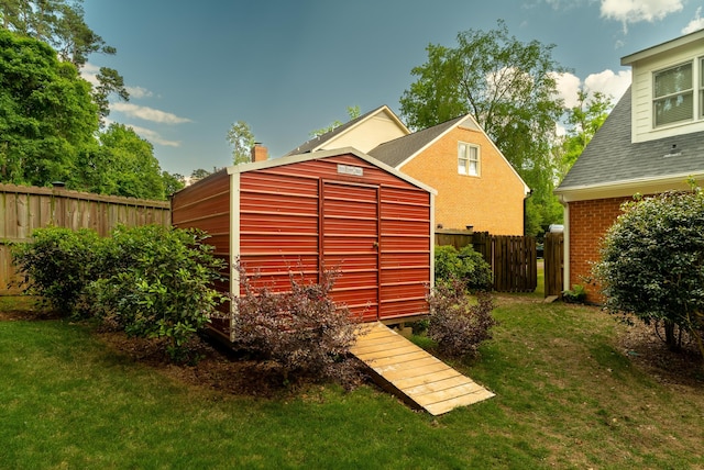 view of outdoor structure featuring a lawn