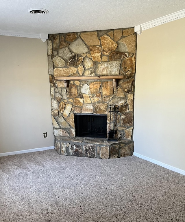 details with ornamental molding, carpet floors, and a stone fireplace