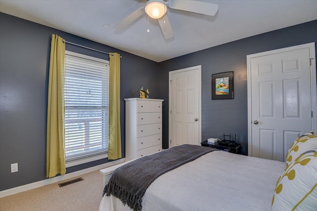 carpeted bedroom featuring ceiling fan