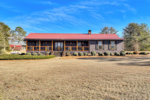 single story home featuring a front yard and a sunroom