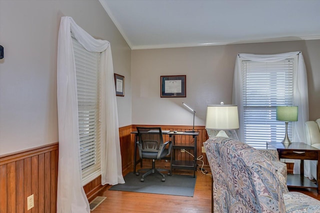 home office featuring light hardwood / wood-style floors and ornamental molding