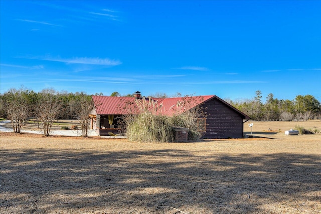 view of outbuilding featuring a lawn