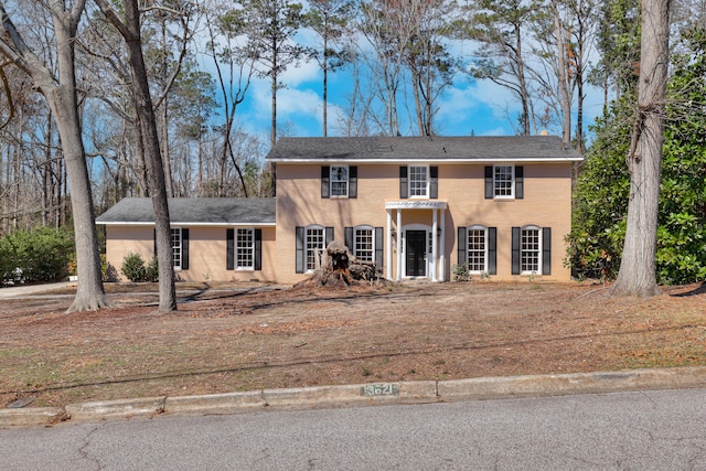 colonial inspired home with stucco siding