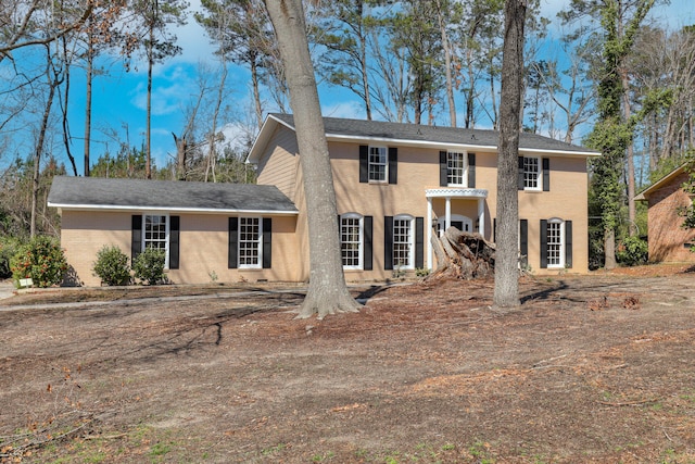 view of front of home featuring brick siding