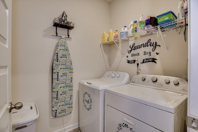 laundry room featuring washing machine and clothes dryer