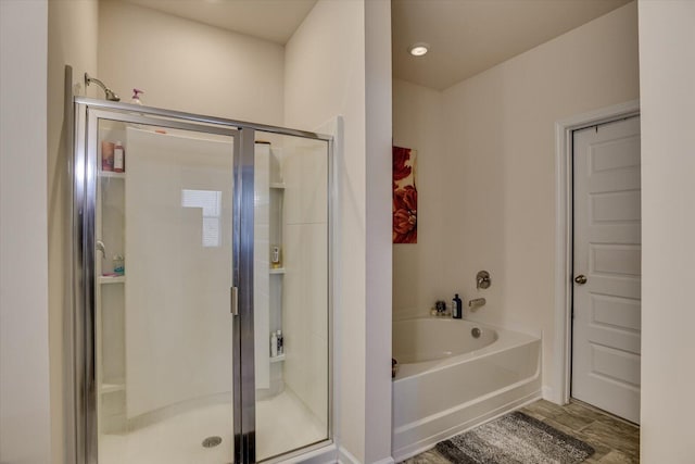 bathroom with shower with separate bathtub