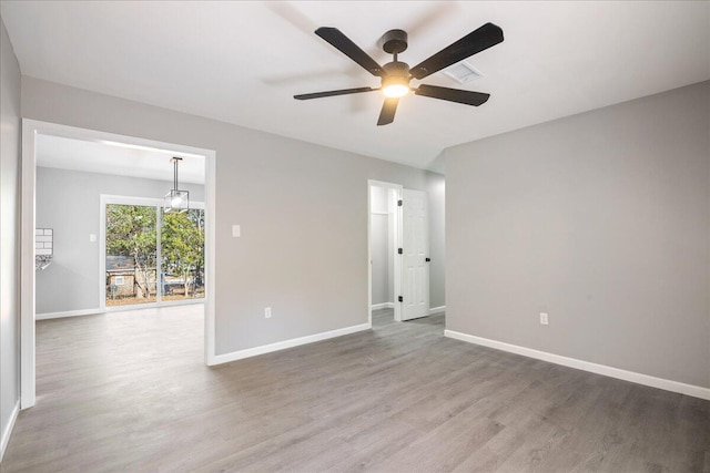 unfurnished room with hardwood / wood-style floors and ceiling fan