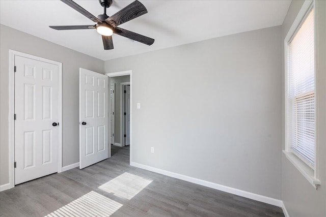 unfurnished bedroom featuring ceiling fan and light hardwood / wood-style floors