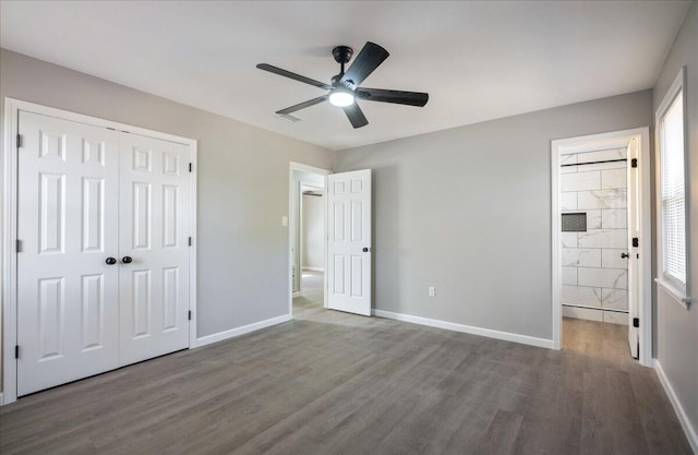 unfurnished bedroom featuring wood-type flooring, a closet, and ceiling fan