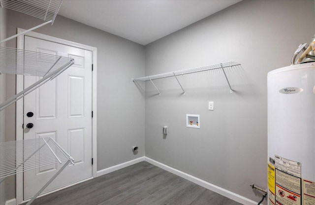 clothes washing area with hookup for a washing machine, gas water heater, dark wood-type flooring, and hookup for an electric dryer