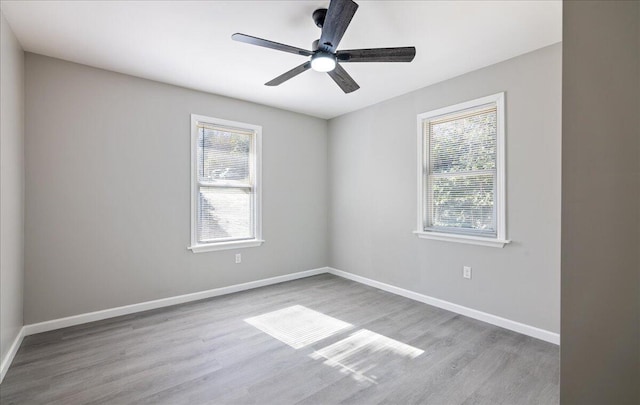 spare room featuring ceiling fan and light wood-type flooring