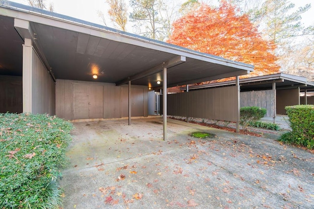 view of vehicle parking featuring a carport