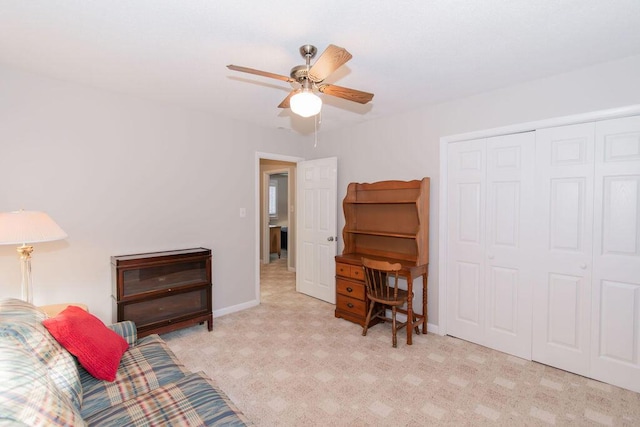 living room with ceiling fan and light colored carpet