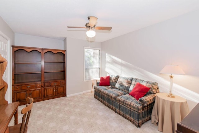 living room featuring ceiling fan and light carpet