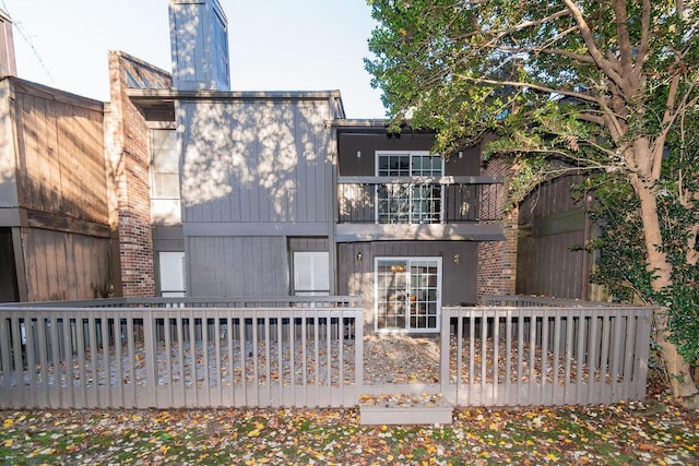 back of house with a balcony