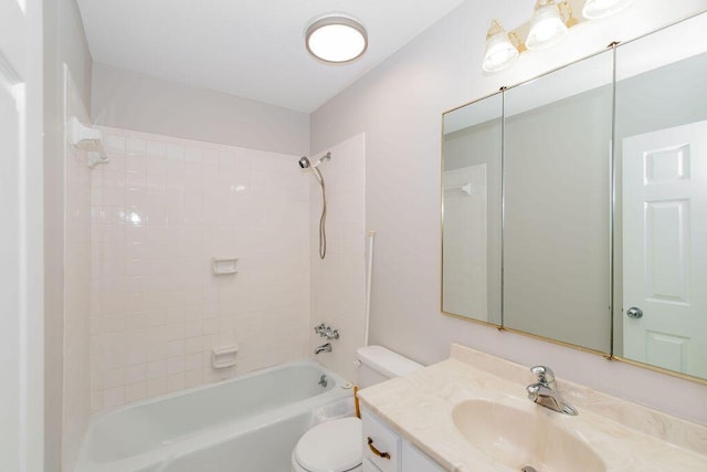 full bathroom with vanity, toilet, and tiled shower / bath